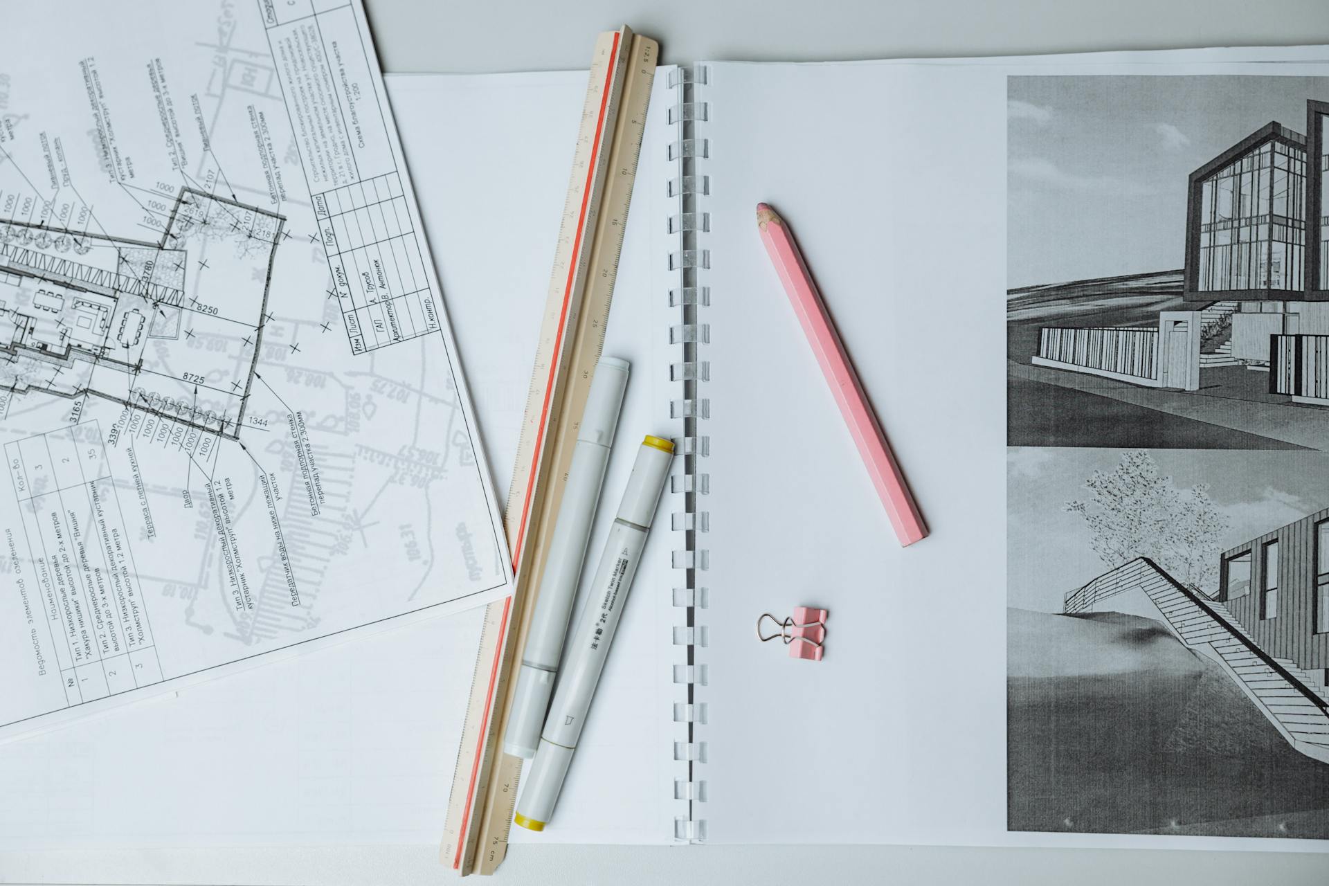 Architectural blueprint with a pen and ruler